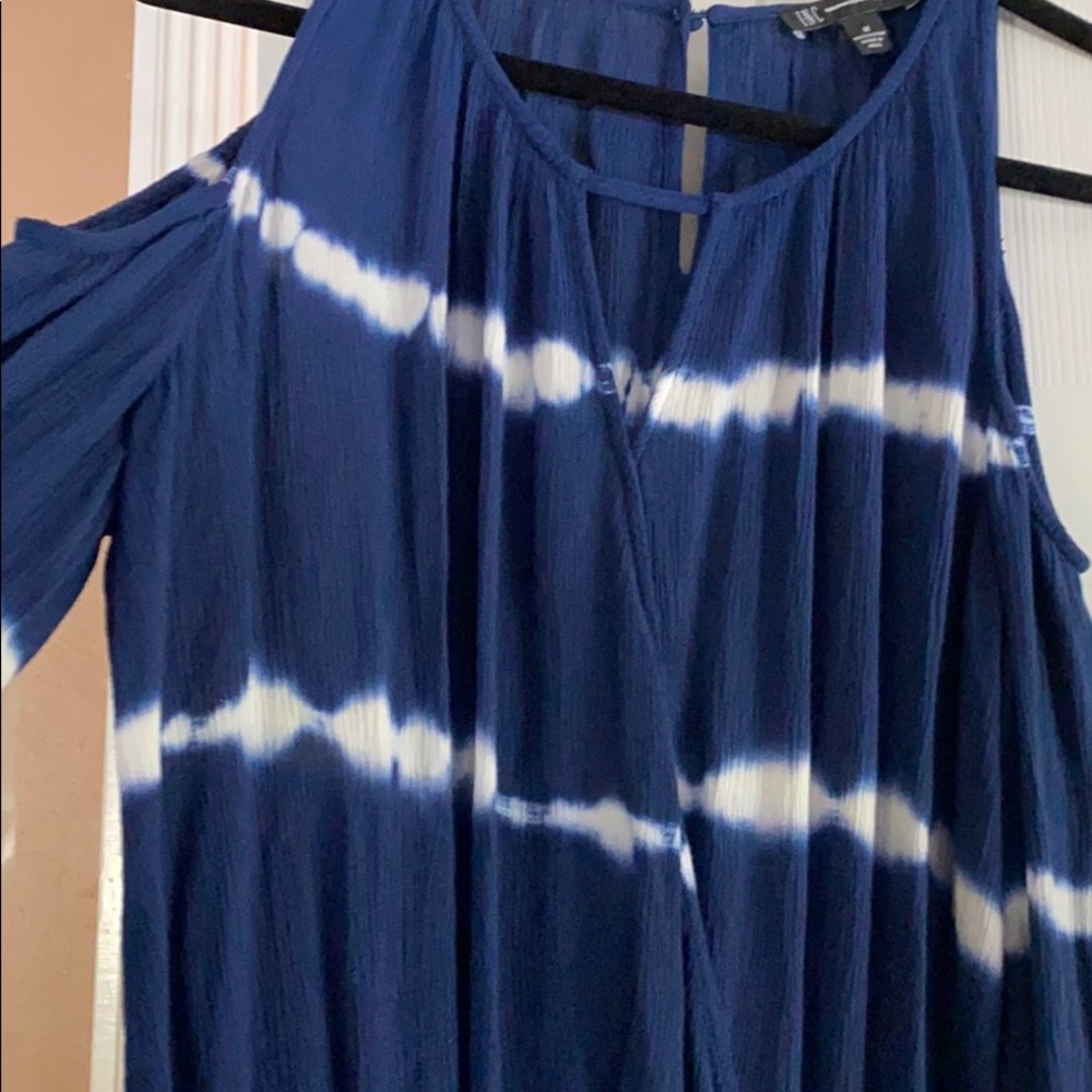 NEW INC Top